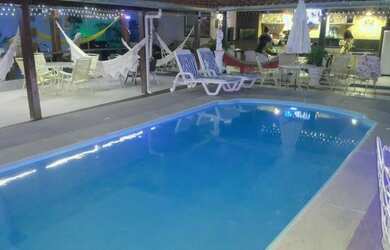 Imagem: A casa possui 5 Dormitórios, 3 Vagas na garagem e está localizado