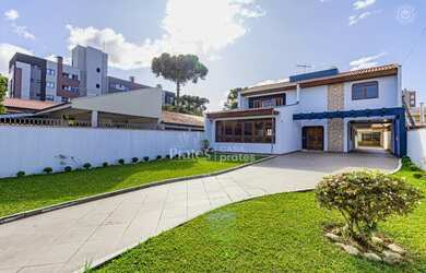 Imagem: A casa possui 4 Dormitórios, 5 Banheiros, 5 Vagas na garagem