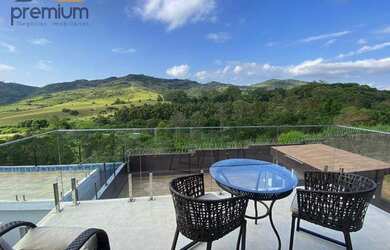 Imagem: A casa em condomínio possui 4 Dormitórios, 5 Banheiros, 4