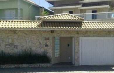 Imagem: A casa possui 5 Dormitórios, 5 Banheiros, 4 Vagas na garagem