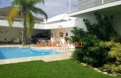 Imagem: A casa em condomínio possui 4 Dormitórios, 5 Banheiros, 4