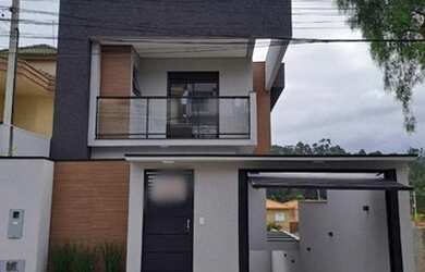 Imagem: A casa possui 3 Dormitórios, 4 Banheiros, 2 Vagas na garagem