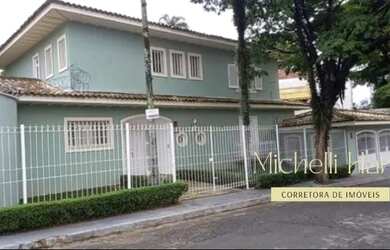 Imagem: A casa possui 5 Dormitórios, 4 Banheiros, 4 Vagas na garagem