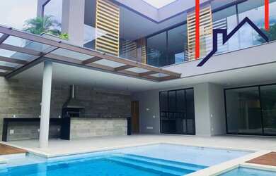 Imagem: A casa em condomínio possui 5 Dormitórios, 5 Banheiros, 4