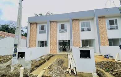 Imagem: A casa possui 3 Dormitórios, 3 Banheiros, 128m² de Área