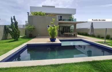 Imagem: A casa possui 4 Dormitórios, 5 Banheiros, 4 Vagas na garagem