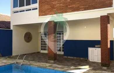 Imagem: A casa possui 4 Dormitórios, 5 Banheiros, 4 Vagas na garagem