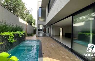 Imagem: A casa em condomínio possui 4 Dormitórios, 5 Banheiros, 4