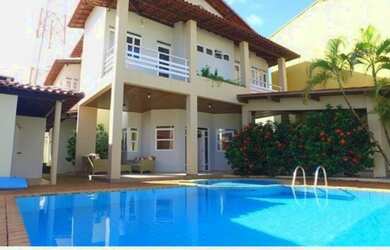 Imagem: A casa possui 5 Dormitórios, 5 Banheiros, 4 Vagas na garagem