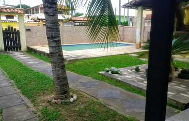 Imagem: A casa possui 5 Dormitórios, 3 Vagas na garagem e está localizado