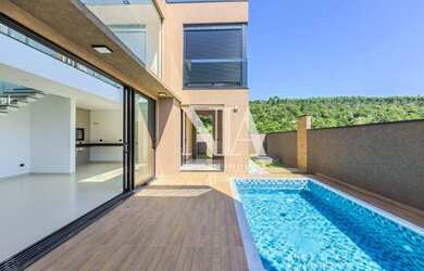 Imagem: A casa em condomínio possui 3 Dormitórios, 5 Banheiros, 4