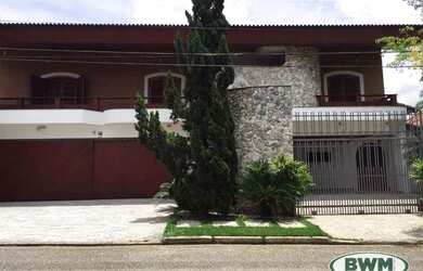 Imagem: A casa possui 5 Dormitórios, 5 Banheiros, 5 Vagas na garagem