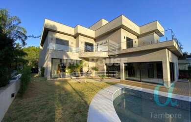 Imagem: A casa possui 5 Dormitórios, 5 Banheiros, 5 Vagas na garagem