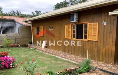 Imagem: A casa possui 5 Dormitórios, 2 Banheiros, 1 Vaga na garagem