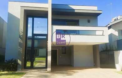 Imagem: A casa possui 4 Dormitórios, 5 Banheiros, 4 Vagas na garagem