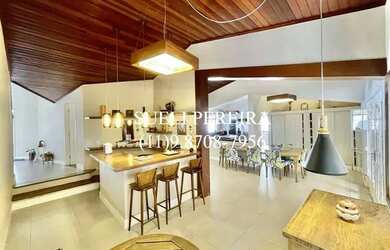 Imagem: A casa possui 3 Dormitórios, 5 Banheiros, 5 Vagas na garagem