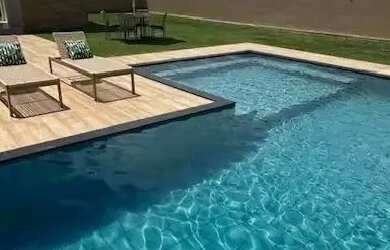 Imagem: A casa em condomínio possui 4 Dormitórios, 5 Banheiros, 2