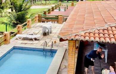 Imagem: A casa possui 4 Dormitórios, 4 Vagas na garagem e está localizado