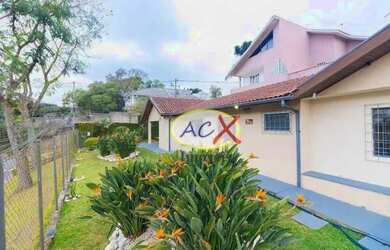 Imagem: A casa possui 4 Dormitórios, 4 Banheiros, 2 Vagas na garagem