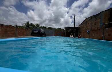 Imagem: A casa possui 3 Dormitórios, 2 Banheiros, 5 Vagas na garagem