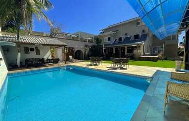 Imagem: A casa possui 5 Dormitórios, 5 Banheiros, 5 Vagas na garagem