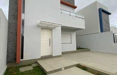 Imagem: A casa e possui 3 Dormitórios, Suítes, 3 Banheiros, 2 Vagas