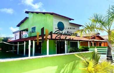 Imagem: A casa possui 5 Dormitórios, 4 Banheiros, 5 Vagas na garagem