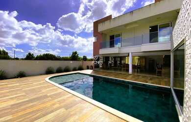 Imagem: A casa possui 5 Dormitórios, 5 Banheiros, 5 Vagas na garagem