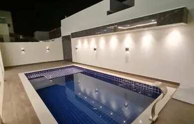 Imagem: A casa em condomínio possui 4 Dormitórios e está localizado