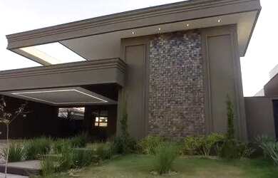 Imagem: A casa possui 4 Dormitórios, 5 Banheiros, 4 Vagas na garagem