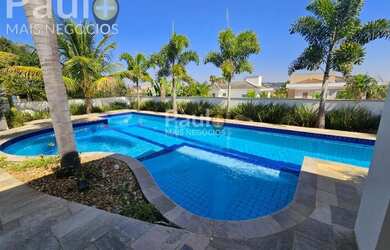 Imagem: A casa em condomínio possui 5 Dormitórios, 5 Banheiros, 5