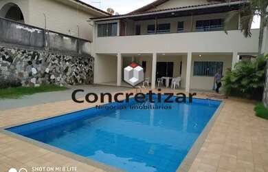 Imagem: A casa possui 5 Dormitórios, 5 Banheiros, 5 Vagas na garagem