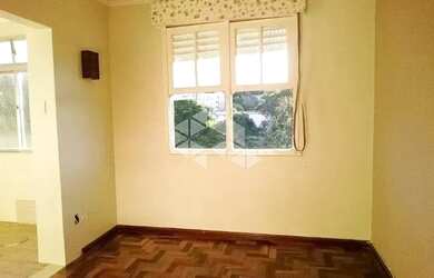 Imagem: O apartamento possui 1 Dormitório, 1 Banheiro, 1 Vaga na garagem