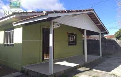 Imagem: A casa possui 3 Dormitórios, 2 Banheiros, 5 Vagas na garagem