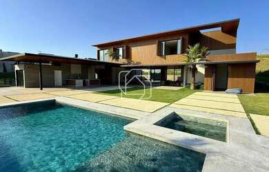 Imagem: A casa em condomínio possui 5 Dormitórios, 5 Banheiros, 4