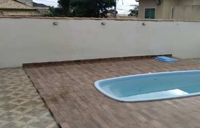 Imagem: A casa possui 2 Dormitórios, 5 Vagas na garagem e está localizado