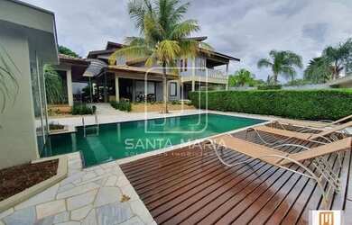 Imagem: A casa possui 3 Dormitórios, 5 Banheiros, 5 Vagas na garagem