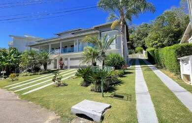 Imagem: A casa possui 5 Dormitórios, 5 Banheiros, 5 Vagas na garagem