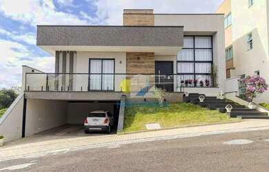 Imagem: A casa possui 3 Dormitórios, 5 Banheiros, 4 Vagas na garagem