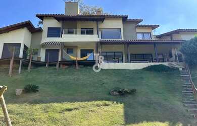 Imagem: A casa possui 5 Dormitórios, 4 Banheiros, 2 Vagas na garagem