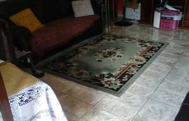 Imagem: A casa possui 3 Dormitórios, 2 Banheiros, 4 Vagas na garagem