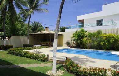 Imagem: A casa possui 5 Dormitórios, 5 Banheiros, 4 Vagas na garagem