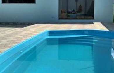 Imagem: A casa possui 3 Dormitórios, 3 Banheiros, 5 Vagas na garagem