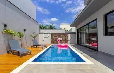 Imagem: A casa em condomínio possui 4 Dormitórios, 5 Banheiros, 2