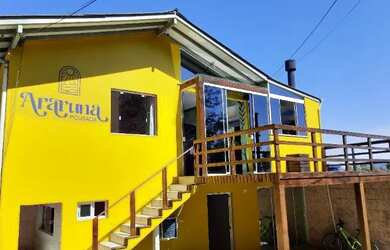 Imagem: A casa possui 5 Dormitórios, 4 Banheiros, 2 Vagas na garagem