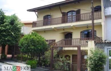 Imagem: A casa possui 4 Dormitórios, 3 Banheiros, 5 Vagas na garagem