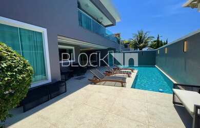 Imagem: A casa em condomínio possui 4 Dormitórios, 5 Banheiros, 331m²