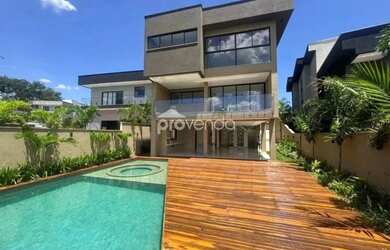 Imagem: A casa possui 5 Dormitórios, 5 Banheiros, 4 Vagas na garagem