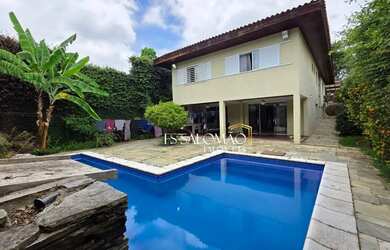 Imagem: A casa possui 3 Dormitórios, 4 Banheiros, 5 Vagas na garagem