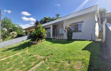 Imagem: A casa possui 3 Dormitórios, 3 Banheiros, 2 Vagas na garagem